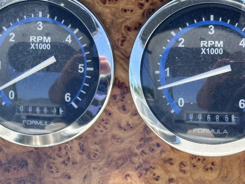 Slide: The Image of Close-up of 2007 Formula 310 Sun Sport RPM gauges on a wooden dashboard. - 20
