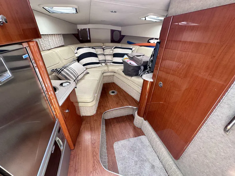 Slide: The Image of Luxurious interior of 2007 Formula 310 Sun Sport boat with plush seating and wood finishes. - 24