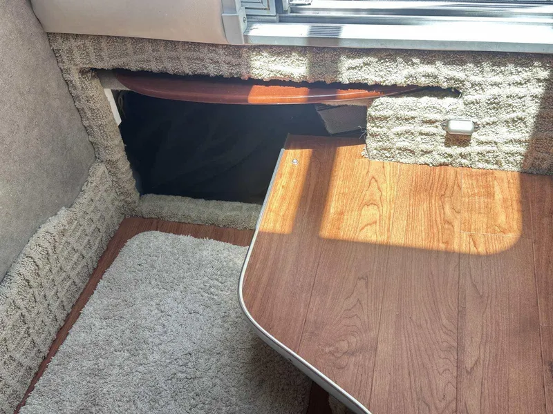 Slide: The Image of Interior of a 2007 Formula 310 Sun Sport boat with wood and carpet flooring. - 26