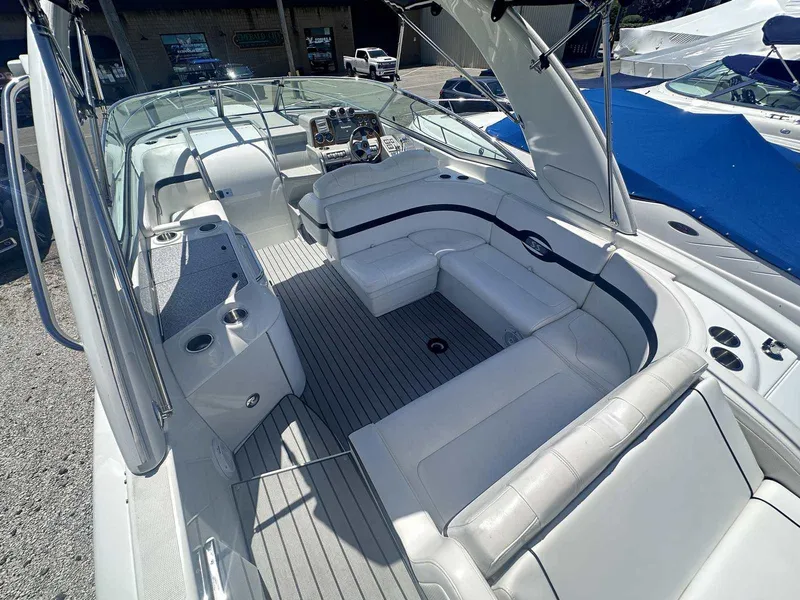 Slide: The Image of 2007 Formula 310 Sun Sport boat interior with white seating and modern dashboard. - 5