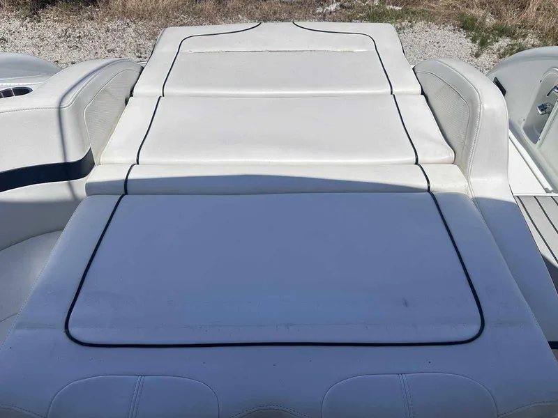 Slide: The Image of 2007 Formula 310 Sun Sport boat with white cushioned seating area. - 6