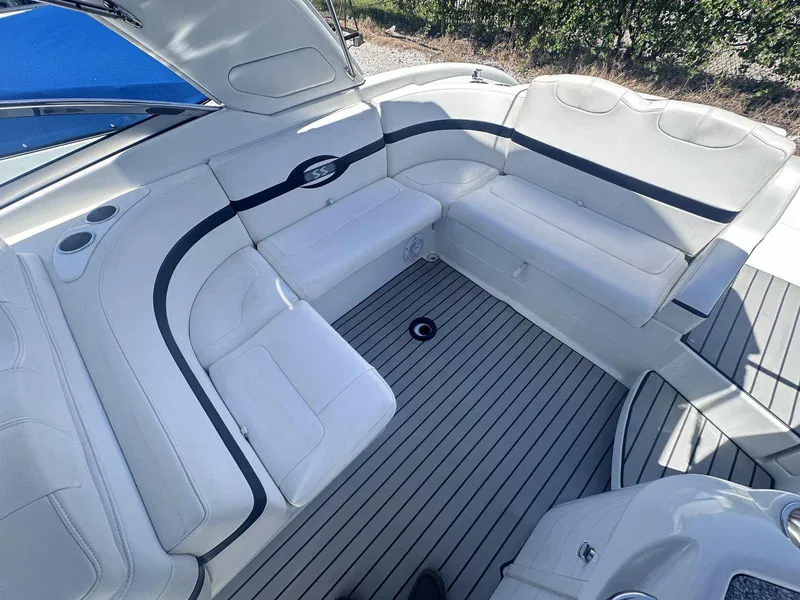 Slide: The Image of 2007 Formula 310 Sun Sport boat interior with white seating and sleek design. - 7