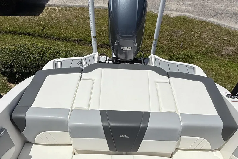 Slide: The Image of 2022 Chaparral 21 SSi OB boat with Yamaha 150 outboard motor, rear seating view. - 10