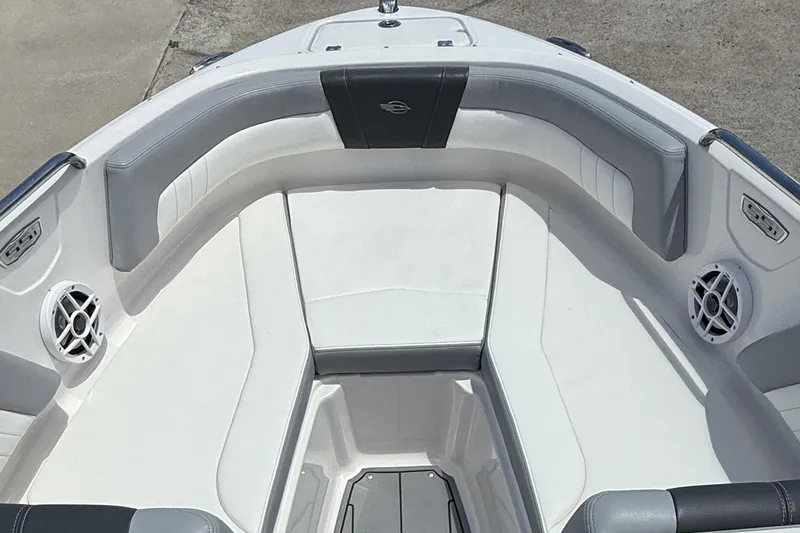 Slide: The Image of 2022 Chaparral 21 SSi OB boat interior with white and gray seating. - 11