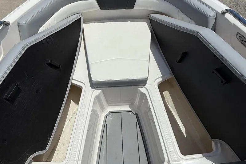Slide: The Image of 2022 Chaparral 21 SSi OB boat interior with open storage compartments. - 15