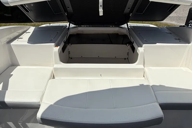 Slide: The Image of 2022 Chaparral 21 SSi OB boat interior with open storage compartment. - 18
