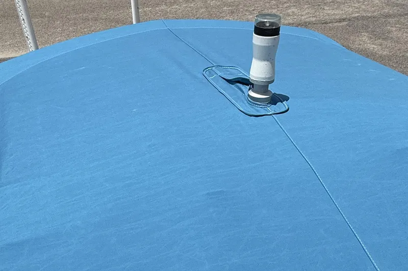 Slide: The Image of Blue cover on 2022 Chaparral 21 SSi OB boat with vent pipe. - 21