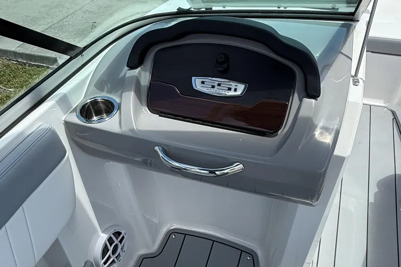 Slide: The Image of 2022 Chaparral 21 SSi OB boat interior with cup holder and storage compartment. - 22