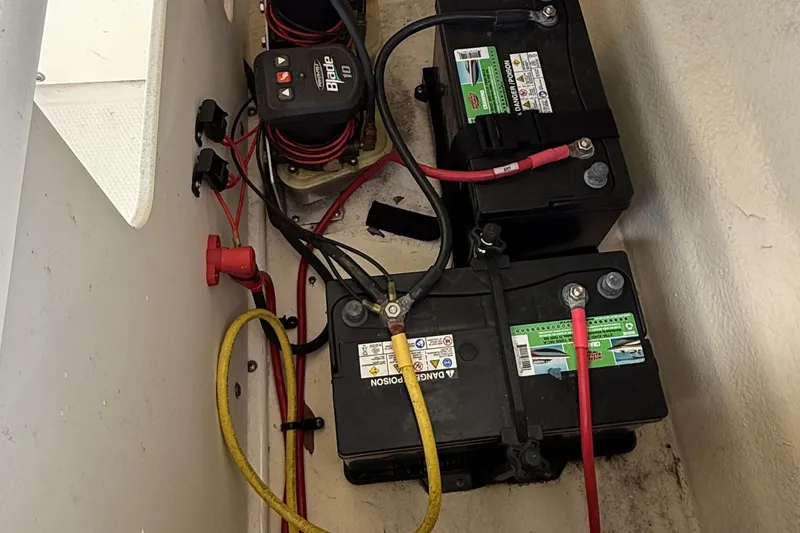 Slide: The Image of Battery compartment of 2022 Chaparral 21 SSi OB with wiring and connections. - 23