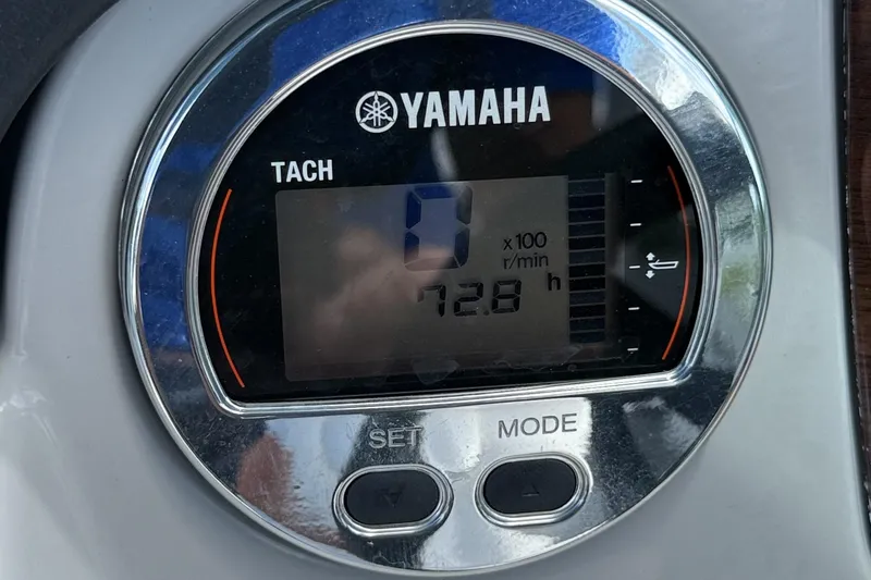Slide: The Image of Yamaha tachometer displaying 728 hours on a 2022 Chaparral 21 SSi OB boat. - 8