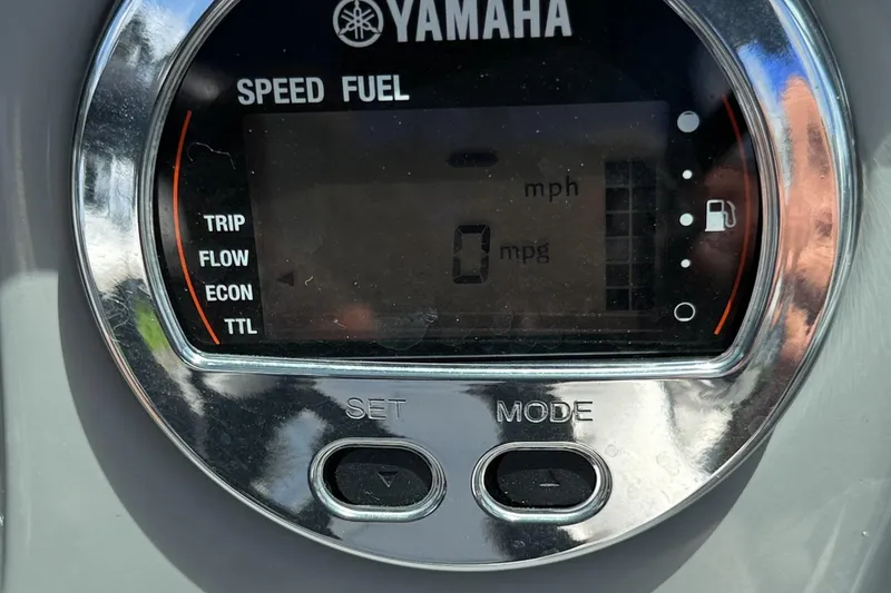 Slide: The Image of Yamaha speed and fuel gauge on 2022 Chaparral 21 SSi OB boat dashboard. - 9