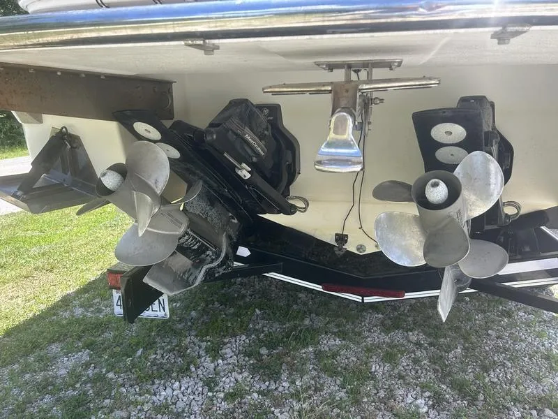 Slide: The Image of Rear view of a 2006 Cobalt 323 boat showing dual propellers and outboard motors. - 9