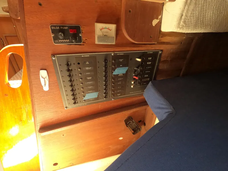 Slide: The Image of Electrical panel on a 1979 Hunter 30 sailboat, featuring bilge pump controls. - 13