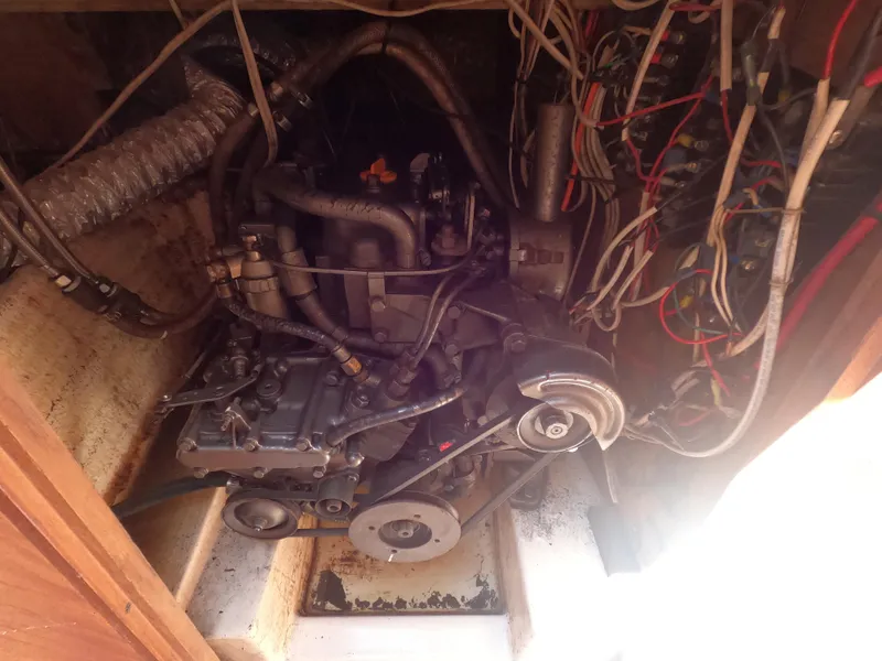 Slide: The Image of 1979 Hunter 30 engine compartment with visible wiring and mechanical components. - 17