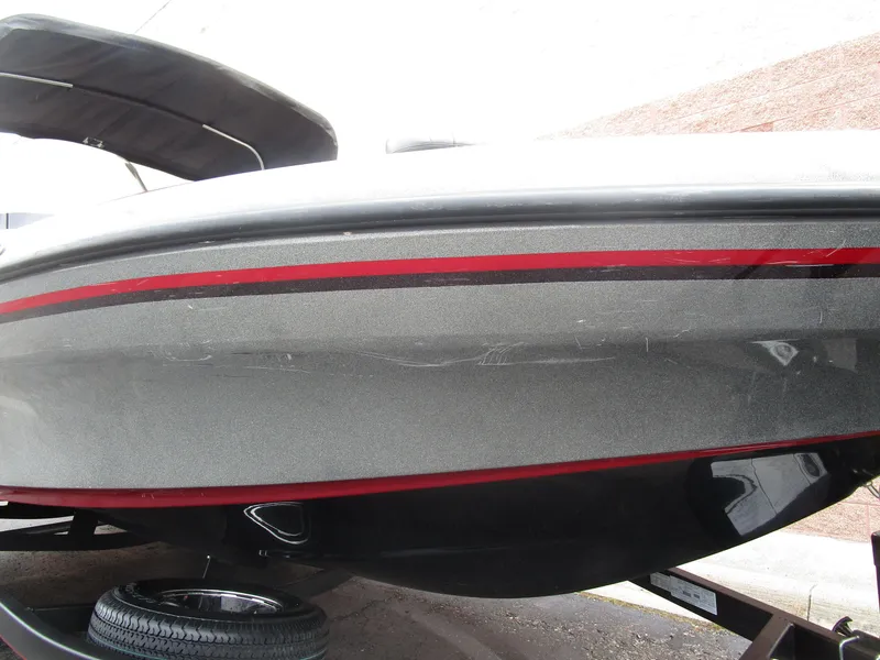 Slide: The Image of 2021 Nitro ZV21 boat with red stripe on trailer. - 10
