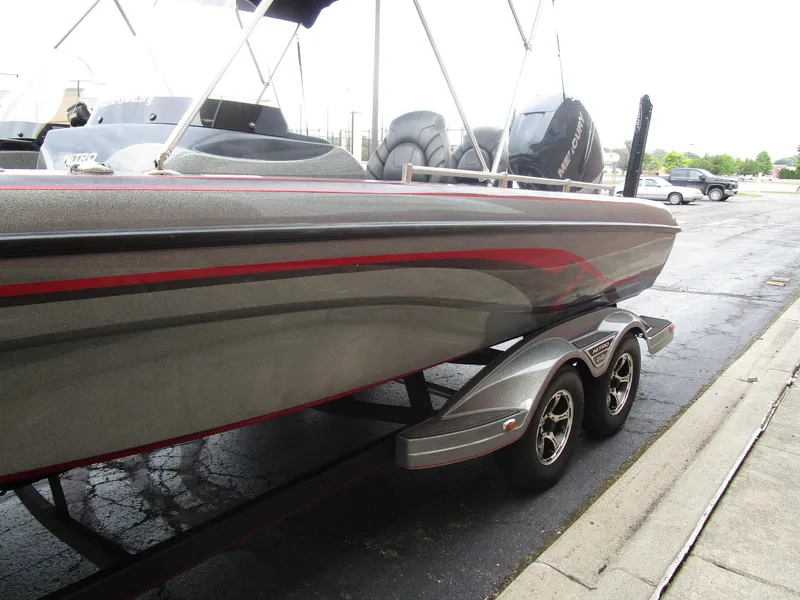 Slide: The Image of 2021 Nitro ZV21 boat on trailer, featuring sleek design and dual Mercury engines. - 12