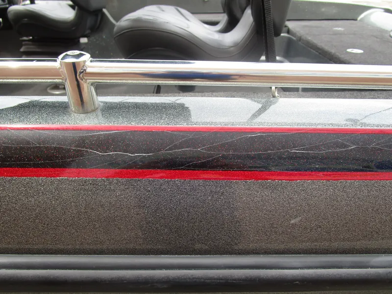 Slide: The Image of 2021 Nitro ZV21 boat detail with metallic finish and red accent stripe. - 13