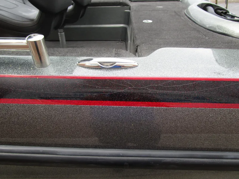 Slide: The Image of 2021 Nitro ZV21 boat interior with sleek metallic finish and red accents. - 14