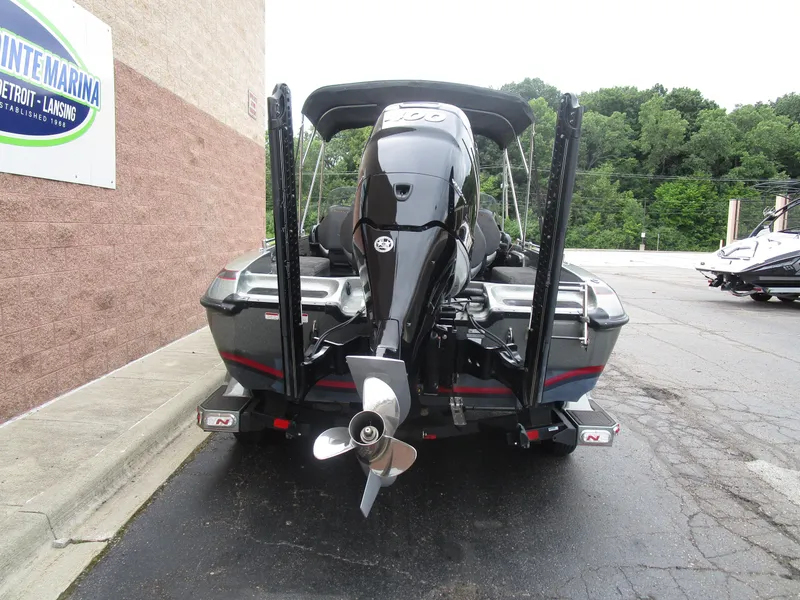 Slide: The Image of Rear view of a 2021 Nitro ZV21 boat with powerful outboard motor. - 16