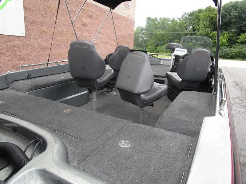 Slide: The Image of 2021 Nitro ZV21 boat interior with gray seating and carpeted deck. - 5