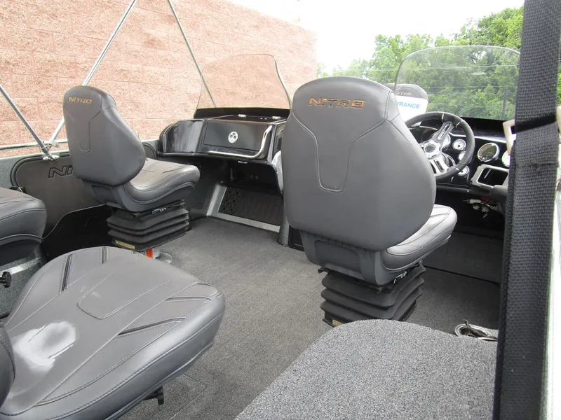 Slide: The Image of Interior of 2021 Nitro ZV21 boat with black leather seats and modern dashboard. - 6
