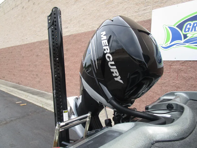 Slide: The Image of Mercury outboard motor on 2021 Nitro ZV21 boat, parked near brick wall. - 7