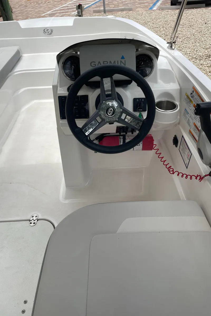 Slide: The Image of 2021 Hurricane SunDeck Sport 185 OB boat cockpit with Garmin navigation system. - 12