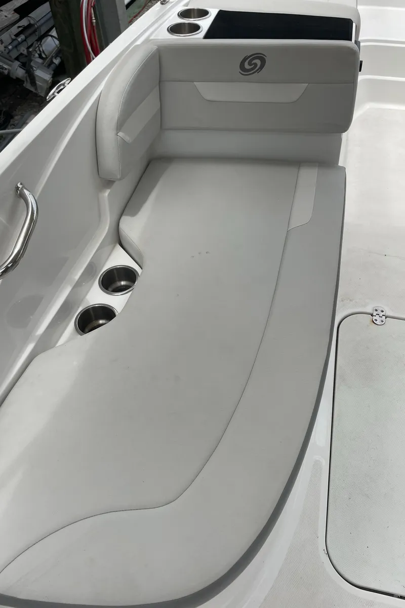 Slide: The Image of 2021 Hurricane SunDeck Sport 185 OB boat interior with cushioned seating and cup holders. - 15