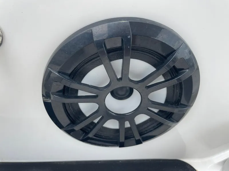Slide: The Image of Close-up of a black speaker grille on a 2021 Hurricane SunDeck Sport 185 OB boat. - 22