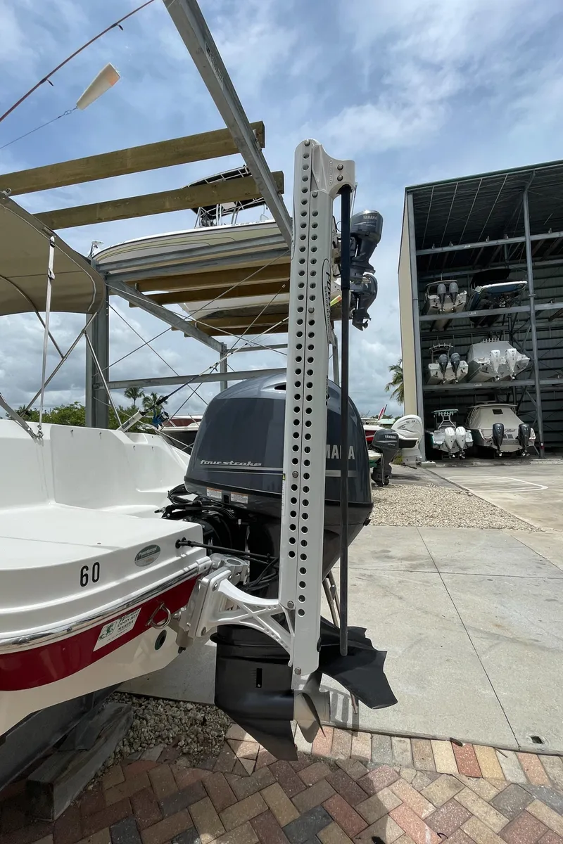 Slide: The Image of 2021 Hurricane SunDeck Sport 185 OB boat with Yamaha outboard motor in storage facility. - 29