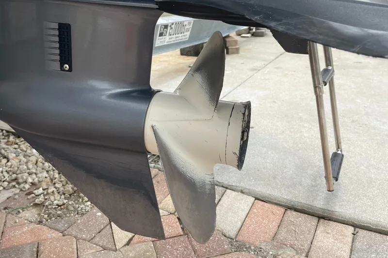 Slide: The Image of Propeller of 2021 Hurricane SunDeck Sport 185 OB boat on a paved surface. - 32