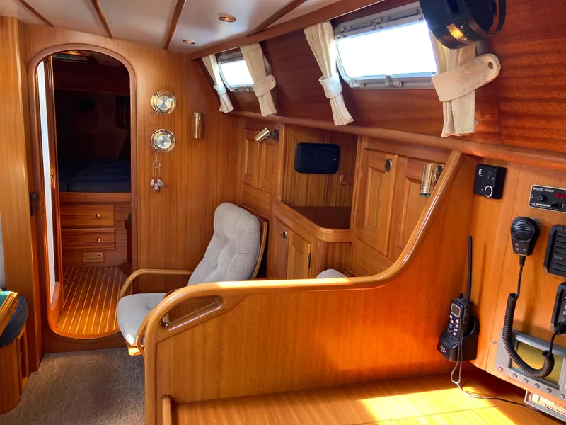 Slide: The Image of Interior of a 2001 Malo 43 yacht with wooden paneling and nautical instruments. - 14