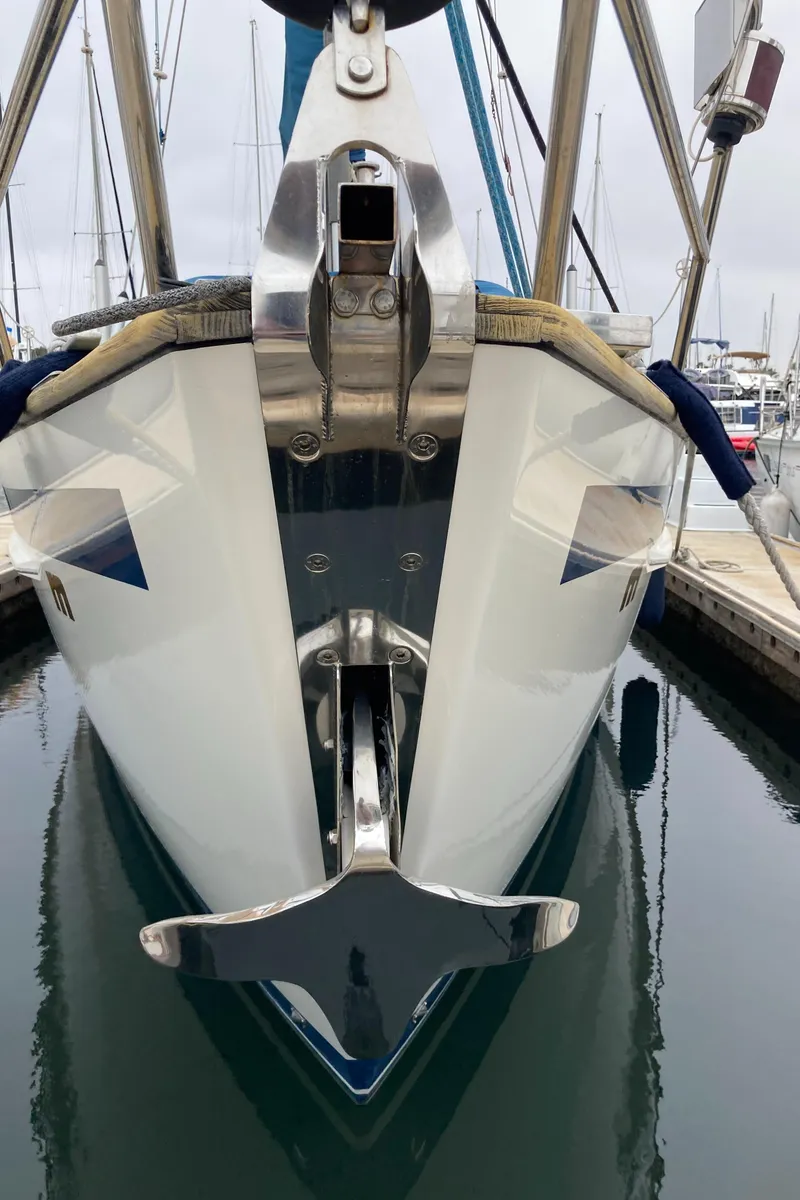 Slide: The Image of Front view of a 2001 Malo 43 yacht docked in a marina. - 21
