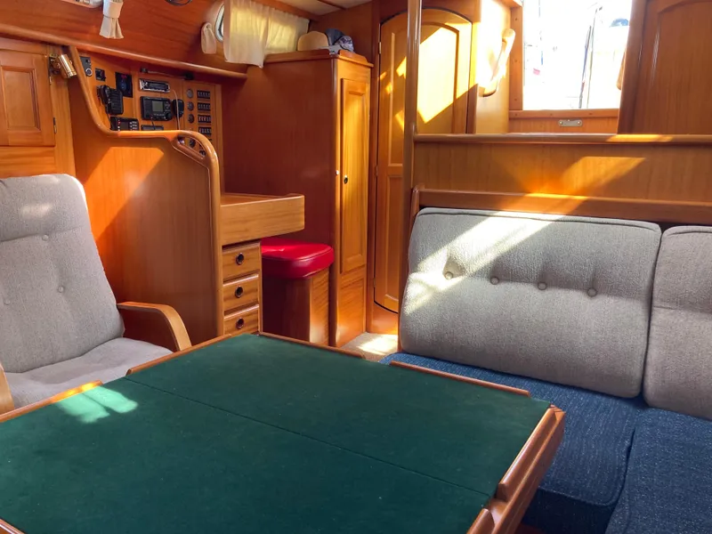 Slide: The Image of Interior of a 2001 Malo 43 yacht with wooden furnishings and seating area. - 23
