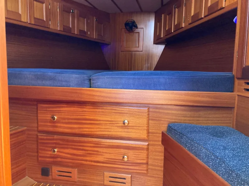 Slide: The Image of Interior cabin of 2001 Malo 43 yacht with wooden finish and blue cushions. - 25