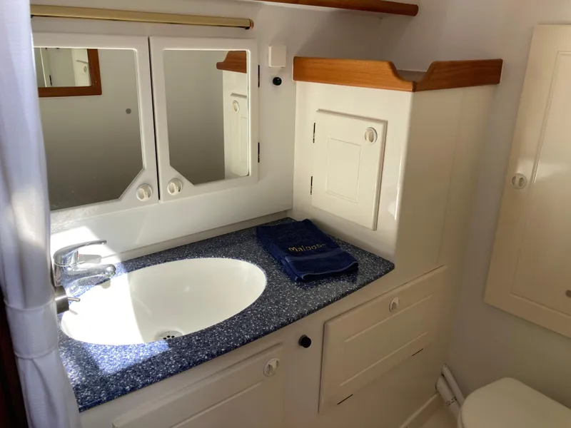Slide: The Image of Bathroom interior of a 2001 Malo 43 yacht with sink and mirror. - 28
