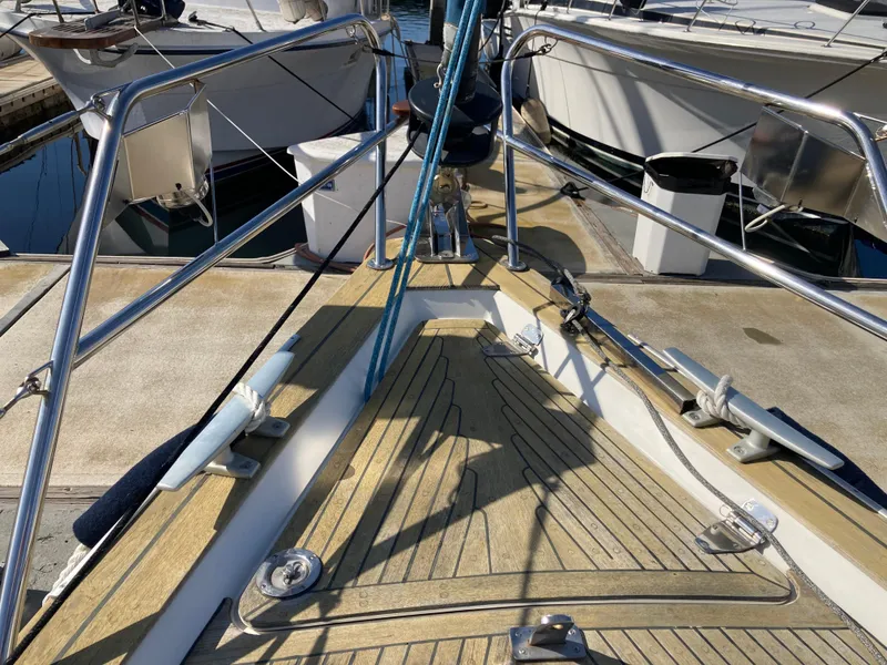 Slide: The Image of Deck of a 2001 Malo 43 sailboat with mooring lines and railings. - 29