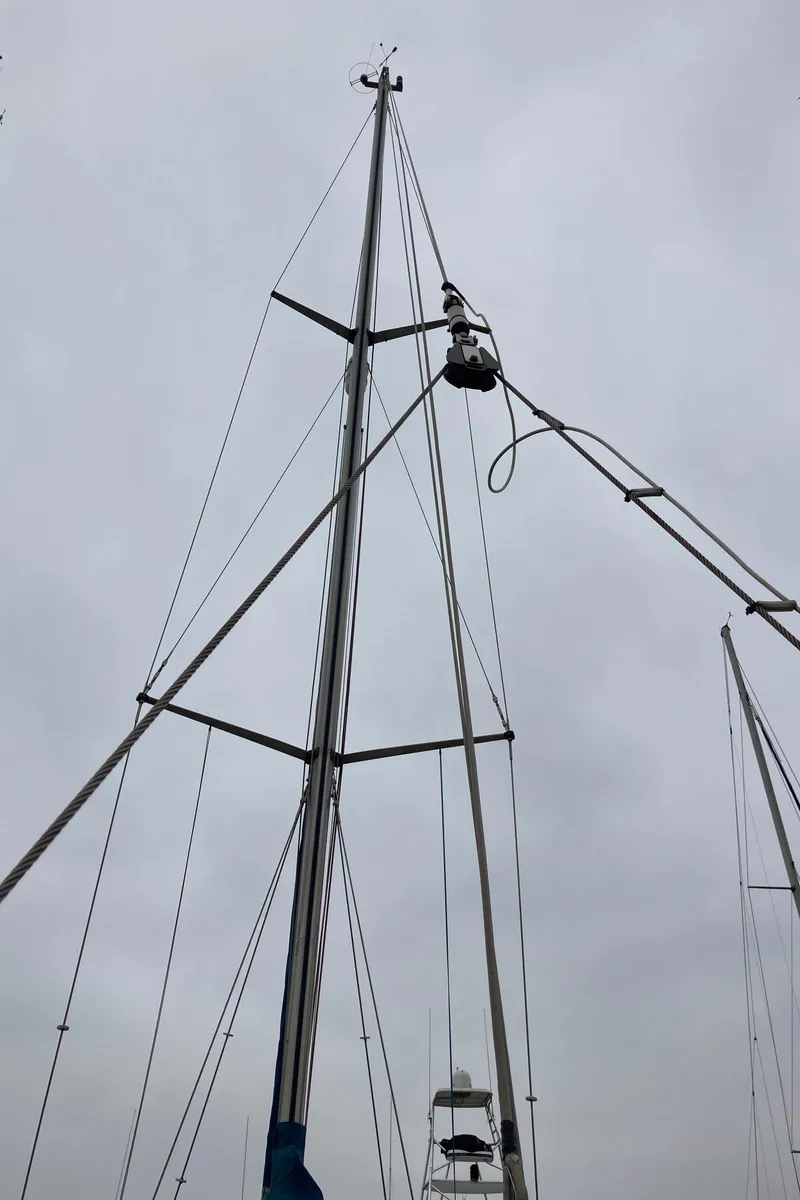 Slide: The Image of Sailboat mast of a 2001 Malo 43 against a cloudy sky. - 43