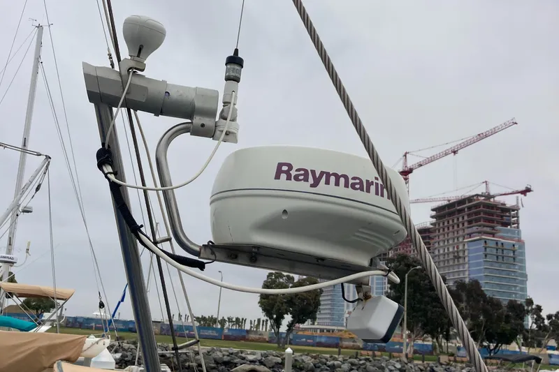 Slide: The Image of Raymarine radar on Malo 43 sailboat, 2001 model, docked near construction site. - 44