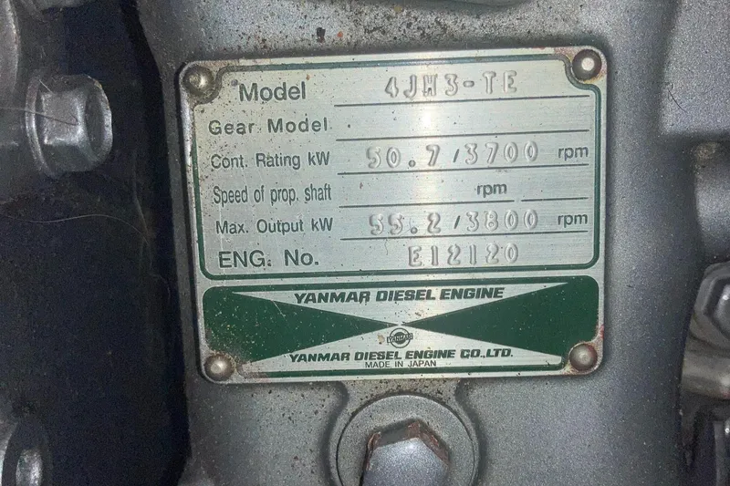 Slide: The Image of Yanmar diesel engine label, model 4JH3-TE, specifications and serial number. - 49