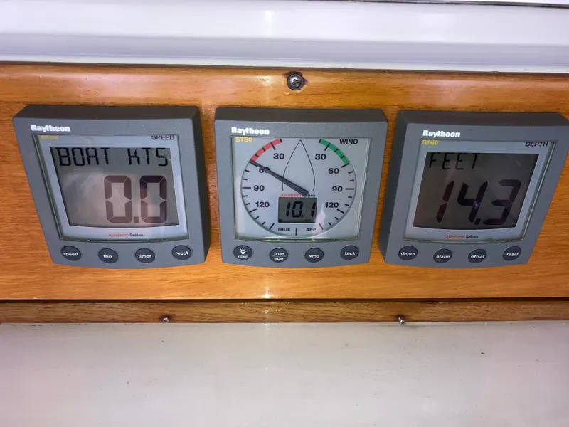Slide: The Image of Boat instrument panel showing speed, wind, and depth readings on a Malo 43, 2001 model. - 56
