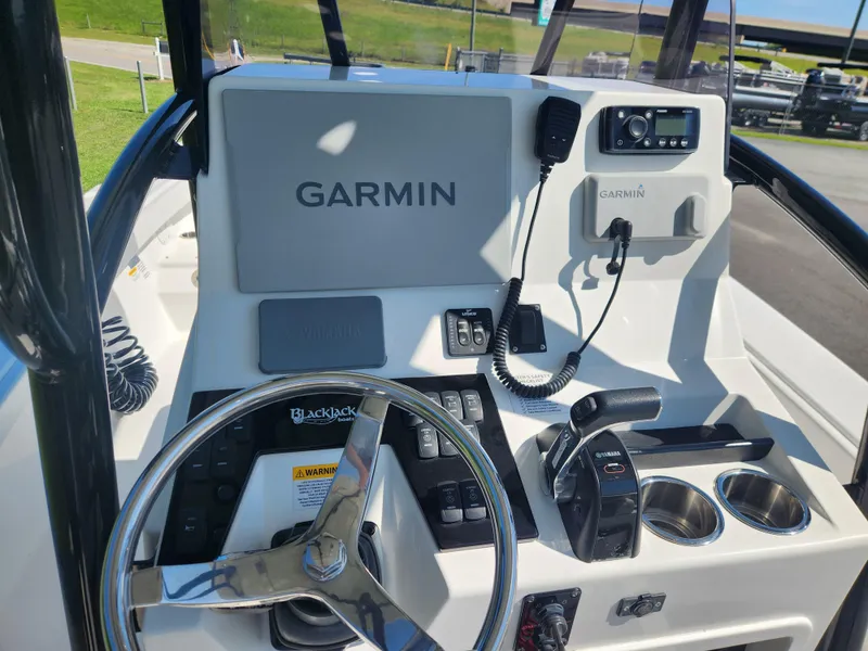 Slide: The Image of 2021 BlackJack 256 Coastal boat console with Garmin navigation and Yamaha controls. - 13