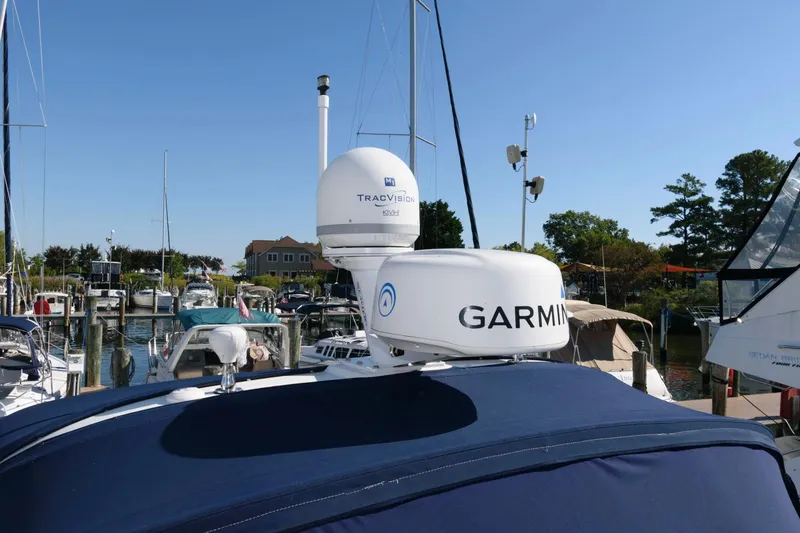 Slide: The Image of Radar equipment on a 2007 Sea Ray 340 Sundancer yacht in a marina. - 12