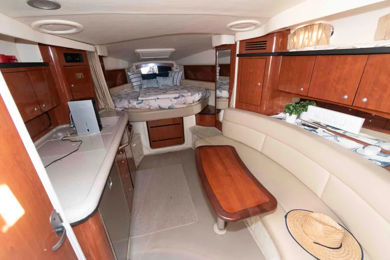 Slide: The Image of Luxurious interior of 2007 Sea Ray 340 Sundancer yacht with wood cabinetry and cozy seating. - 13