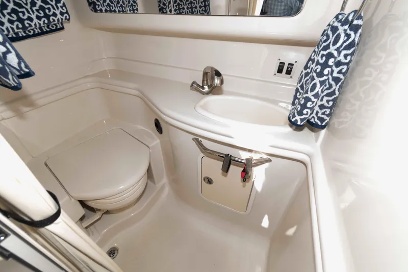 Slide: The Image of Bathroom interior of 2007 Sea Ray 340 Sundancer yacht with sink and toilet. - 19