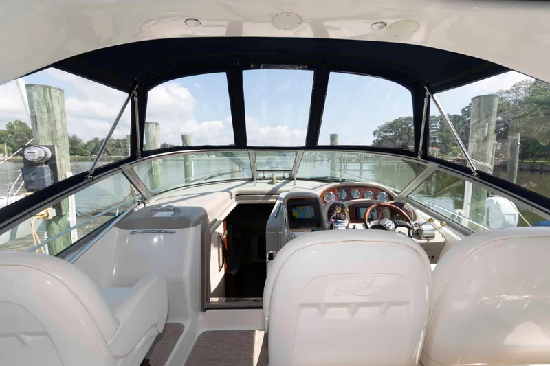 Slide: The Image of Interior view of 2007 Sea Ray 340 Sundancer boat cockpit with steering wheel and dashboard. - 4