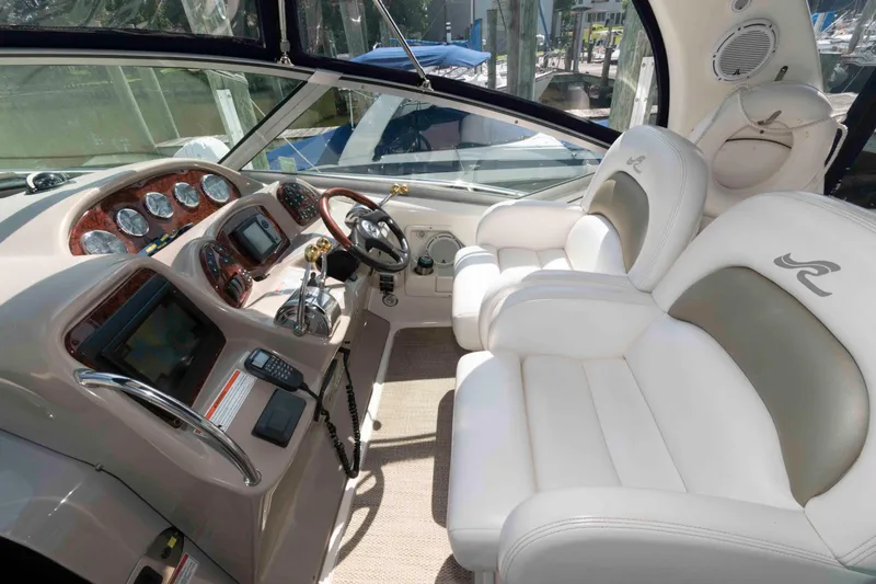 Slide: The Image of Luxurious 2007 Sea Ray 340 Sundancer cockpit with white leather seating and advanced navigation controls. - 5