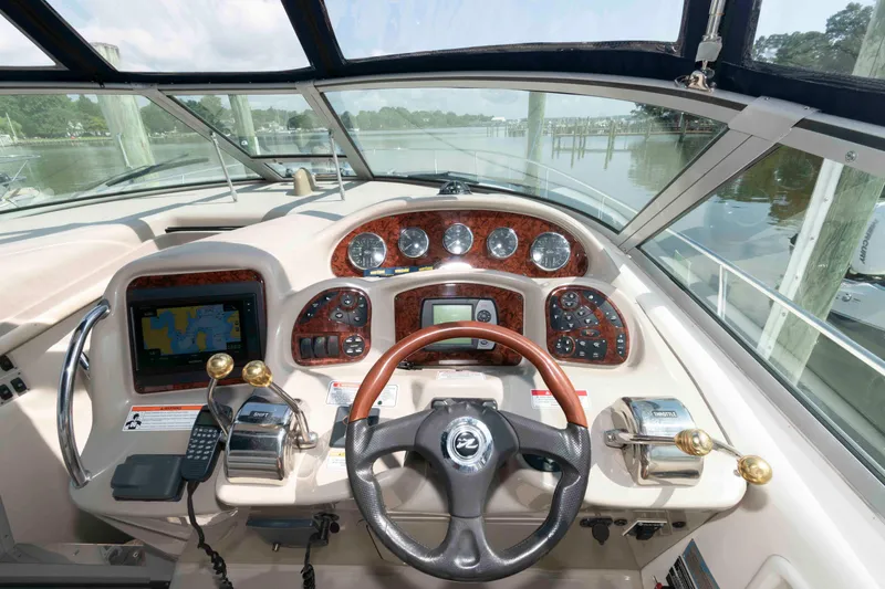 Slide: The Image of 2007 Sea Ray 340 Sundancer helm with navigation controls and steering wheel. - 8