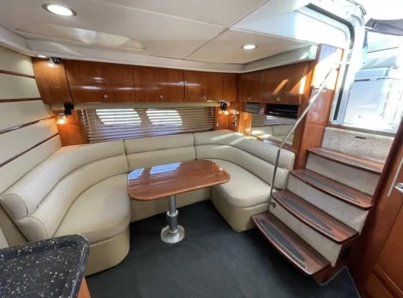 Slide: The Image of Luxurious 2008 Four Winns V458 yacht interior with elegant seating and wooden accents. - 12