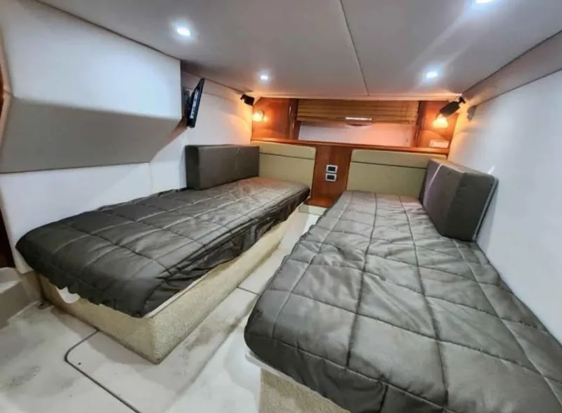 Slide: The Image of Interior cabin of 2008 Four Winns V458 yacht with twin beds and modern lighting. - 15